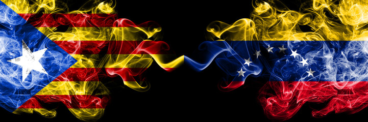 Catalonia vs Venezuela, Venezuelan smoke flags placed side by side. Thick colored silky smoke flags of Catalonia and Venezuela, Venezuelan