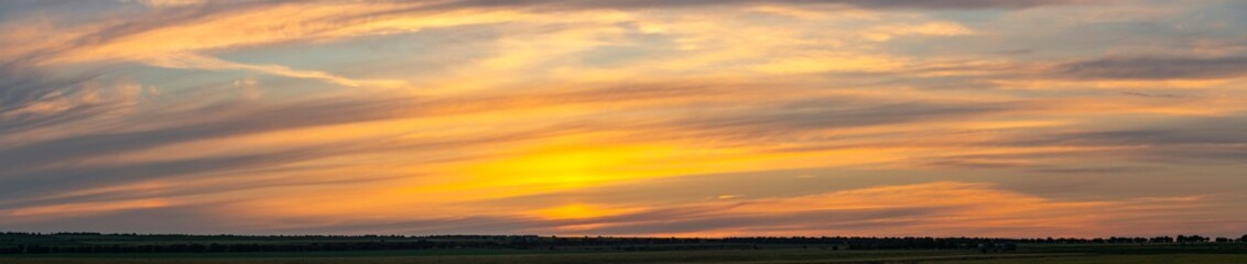Landscape with bloody sunset. The terrain in southern Europe. Tragic gloomy sky. Purple-magenta clouds.