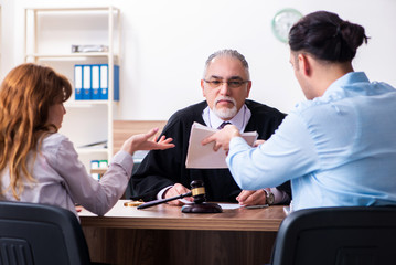 Young couple in the courthouse in divorce concept  