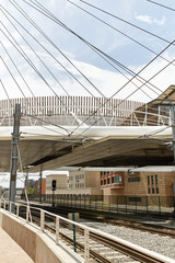 Train tracks near Union Station, under the Millennium Bridge in the Riverfront Park neighborhood of Denver, Colorado