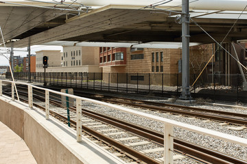 Fototapeta na wymiar Train tracks near Union Station and the Millennium Bridge in the Riverfront Park neighborhood of Denver, Colorado 