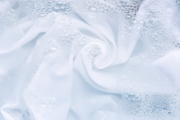 Soak a cloth before washing, white cloth. - Powered by Adobe