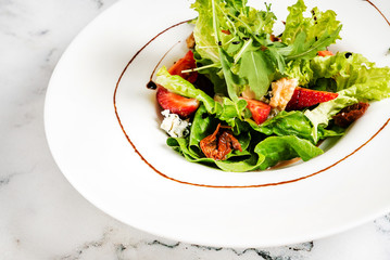 healthy salad with strawberries and cheese