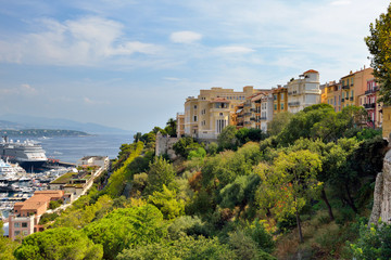 Fototapeta na wymiar Monaco, Monte carlo. Monaco village with colorful architecture and street along the ocean.