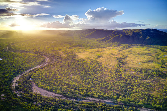 Sunyet over the dry river bed of the the Reid River, Townsville Charters Towers