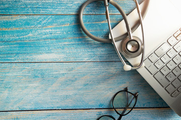 Stethoscope on laptop on table.  Object for doctor and technology