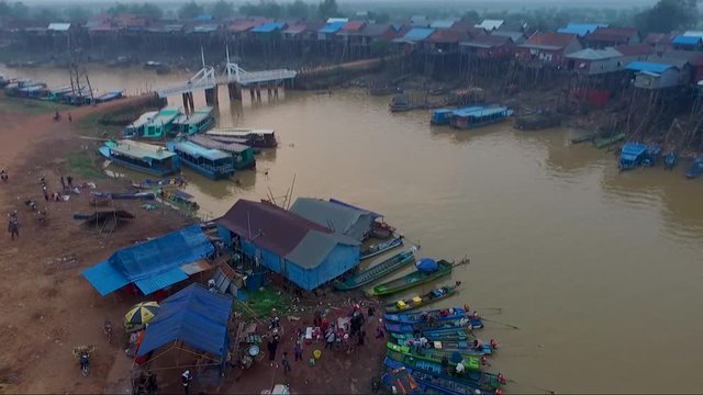 Aerial view of  pan and tilt revealing shot of a bridge, Tonle sap, Kompong Khleang, Cambodia