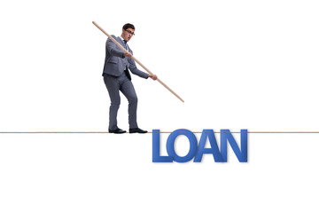 Debt and loan concept with businessman walking on tight rope