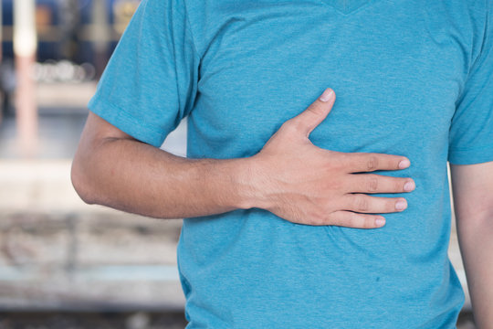 sick man suffering from stomachache, heart burn, acid reflux, GER Disease or GERD
