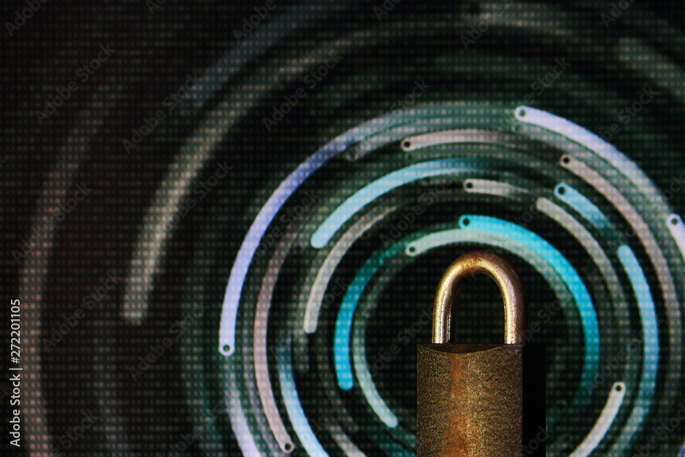 Poster padlock closed. padlock placed in front of circular defocus bokeh light. digital computer and intern