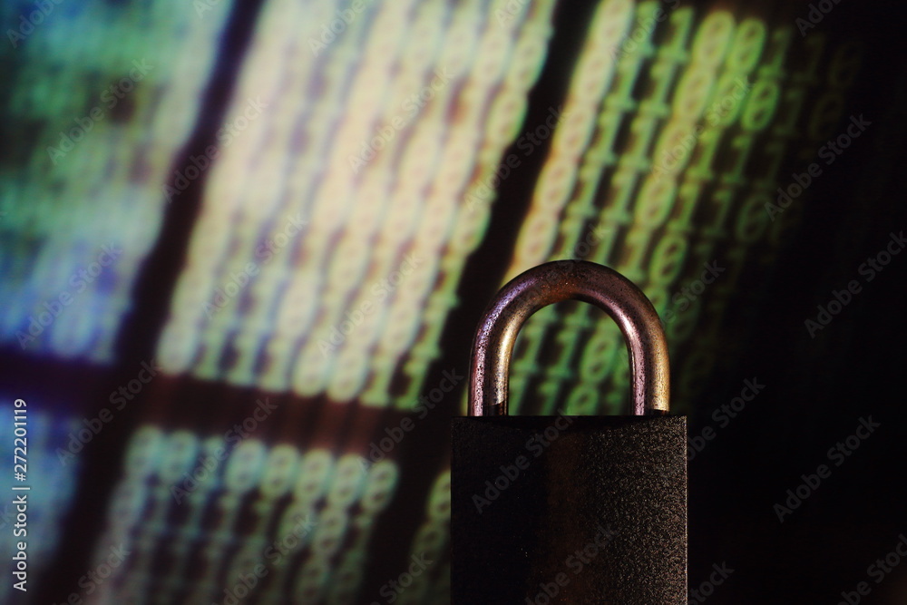 Poster binary computer language matrix blurred be hide an iron padlock. sign of computer privacy protection