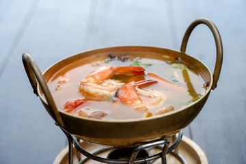 Tom yam kung or Tom yum, Tom yam is a spicy clear soup typical in Thailand. Popular food in Thailand