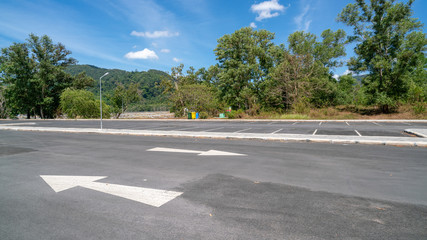 Arrow symbol sign in Parking ,parking lot, parking lane outdoor with blue sky background