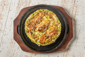 お好み焼き  Okonomiyaki is a Japanese-style pancake
