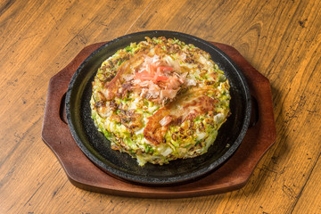 お好み焼き  Okonomiyaki is a Japanese-style pancake