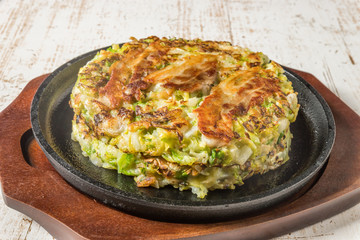 お好み焼き  Okonomiyaki is a Japanese-style pancake