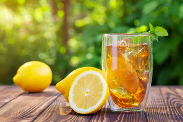 glass of ice tea on wooden table