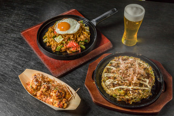 お好み焼き  Okonomiyaki is a Japanese-style pancake