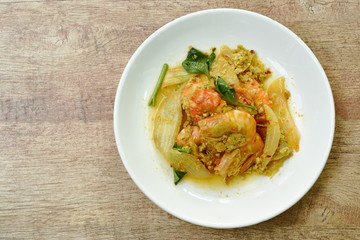 stir-fried shrimp with egg and yellow curry on dish