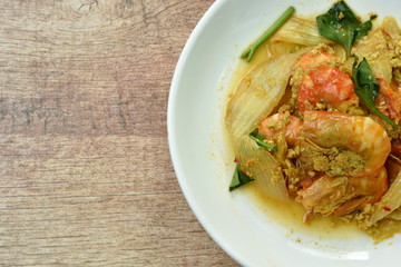 stir-fried shrimp with egg and yellow curry on dish