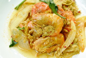 stir-fried shrimp with egg and yellow curry on dish