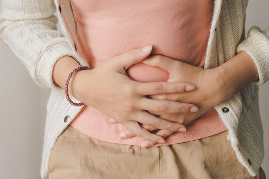 Young woman suffering from abdominal pain. Menstrual pain.