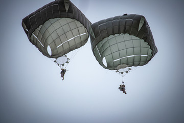 parachutist helicopter airborne operations airplane explosions missiles