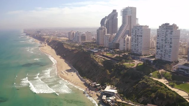 Flying above Natanya promenade area, Israel, 4k drone aerial skyline view 