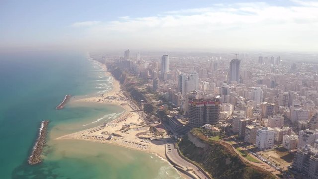Flying above Natanya promenade area, Israel, 4k drone aerial skyline view 
