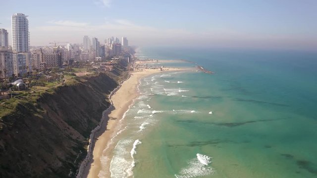 Flying above Natanya promenade area, Israel, 4k drone aerial skyline view 