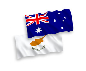 National vector fabric wave flags of Australia and Cyprus isolated on white background. 1 to 2 proportion.