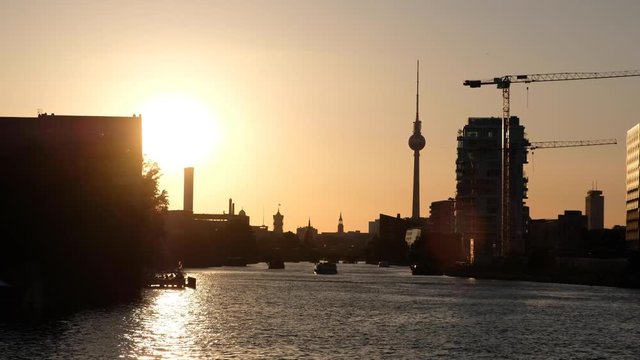 sunset sky over river spree in Berlin with Tv tower skyline