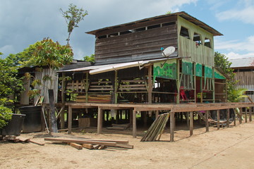 Fototapeta na wymiar Houses in the village San Antonio de Cacao at Amazonas river in Peru