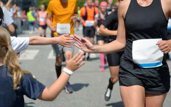 Marathon Running Race,runners Support On Road Race, Child's Hand Giving Highfive, Kid Supporting Athletes Who Run, Sport Concept