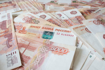 A lot of russian money banknotes of roubles, background
