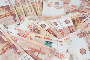 A lot of russian money banknotes of roubles, background