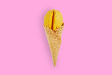 Creative ideas yellow mango ice cream on pastel pink background. Minimal food concept. Flat lay....