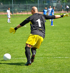 Goalkeeper kicks off the ball