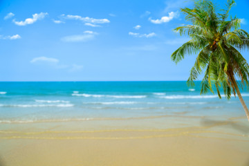 Naklejka na ściany i meble Beach with blurry blue ocean and sky,palm tree background ,Summer Concept .