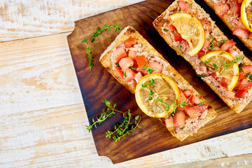 Appetizer bruschetta with tuna and tomatoes. Italian cuisine.