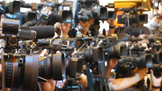 Cameras lined up covering public event