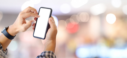 Man using mobile smartphone over bokeh background