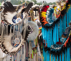 Two Native American Fancy Dancers at a Pow Wow from Behind