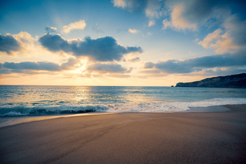 Sunset over the sea. Atlantic ocean in the evening. Nazare, Portugal, Europe