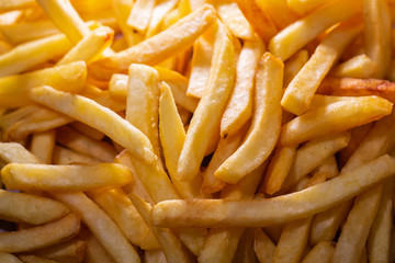 French Fries Potato Cooking Deep Fried in Hot Oil in Basket of Frying Machine