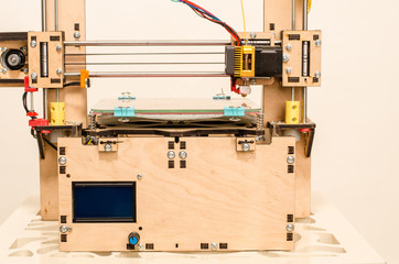Modern 3D printer printing figure close-up macro