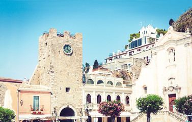Fototapeta premium Beautiful cityscape of Italy, facade of old baroque buildings with Cathedral of Saint Giuseppe on the square of 9 April in Taormina, Sicily.