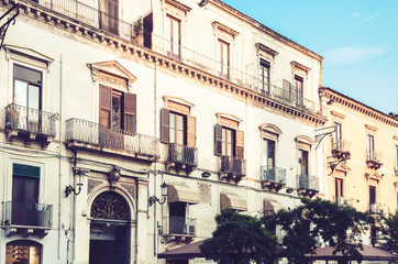 Fototapeta na wymiar Italy, beautiful cityscape of Sicily, historical street of Catania, facade of old buildings .