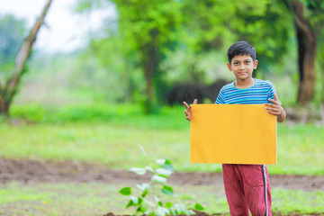 indian child holding empty poster