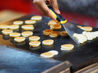 Obraz na płótnie Canvas cooking pancake Dessert on steel pan